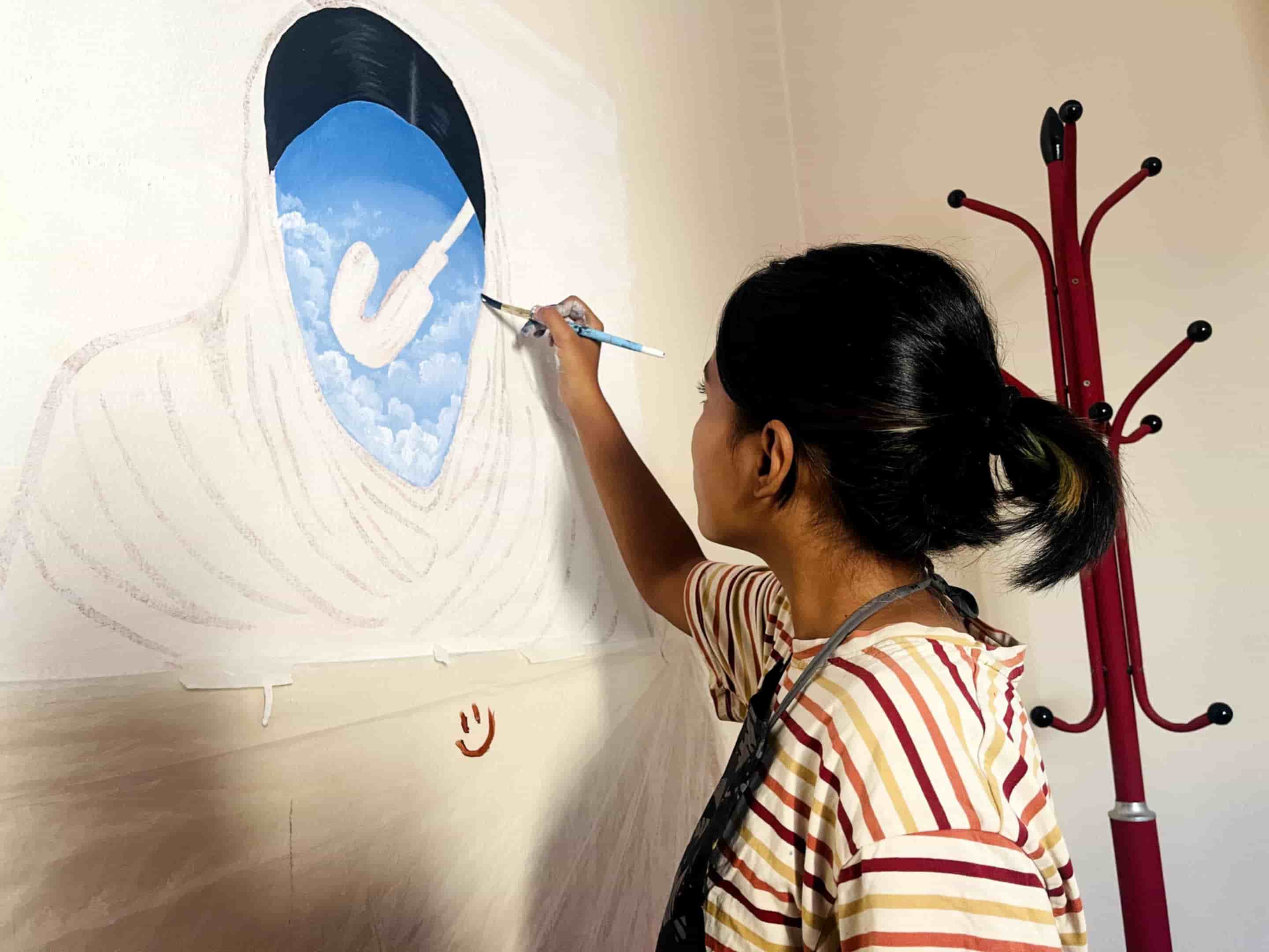 Photo: Prativa Khadka, an artist and fine arts student working on her painting