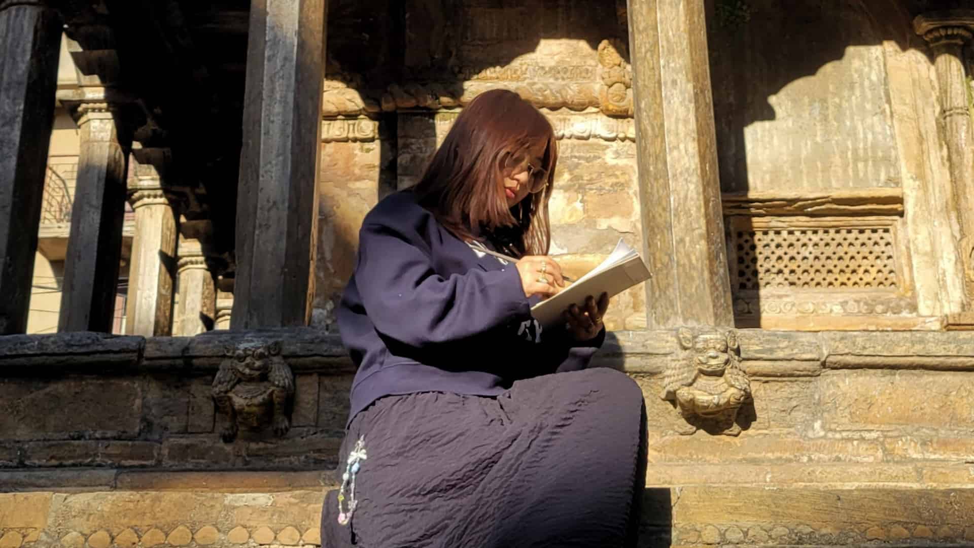 Photo: Kalaami, an illustrator and digital artist urbansketching at Patan
