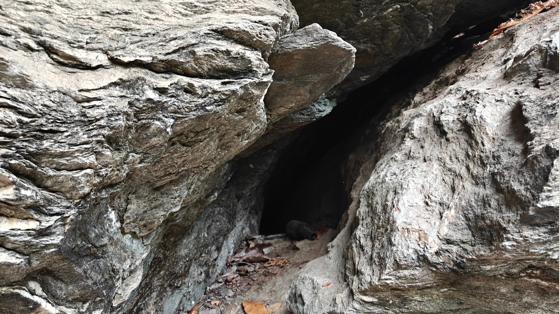 A hand-dug cave in Sertung used by local miners in the search for gemstones.